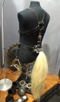 a mannequin with a long hair and a harness